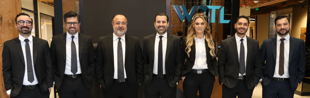 A row of attorneys from West Coast Trial Lawyers.