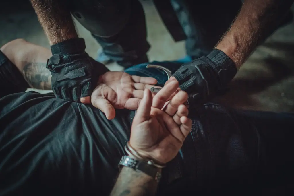 An officer arresting someone.
